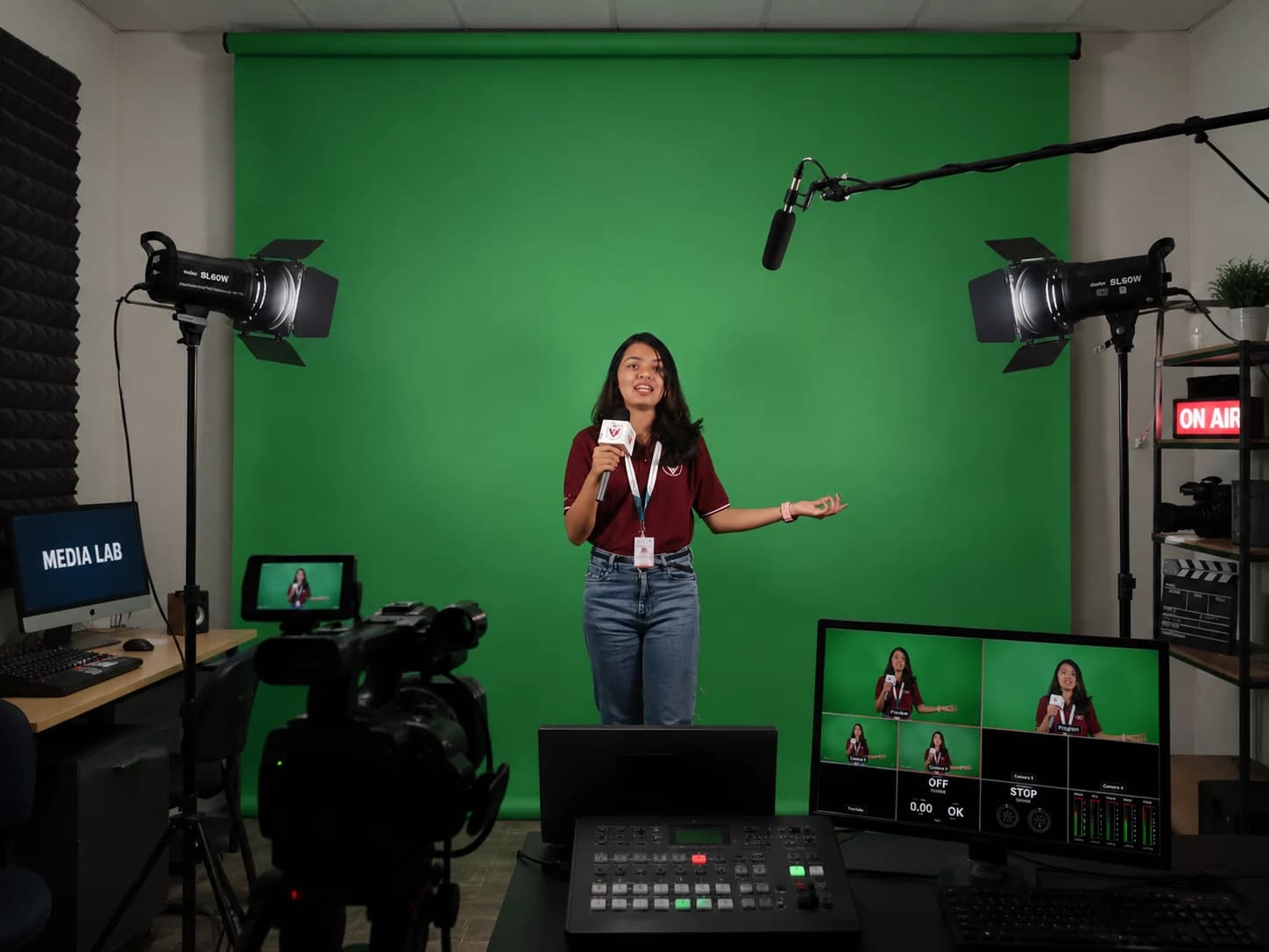 Student presenting in a professional green-screen studio